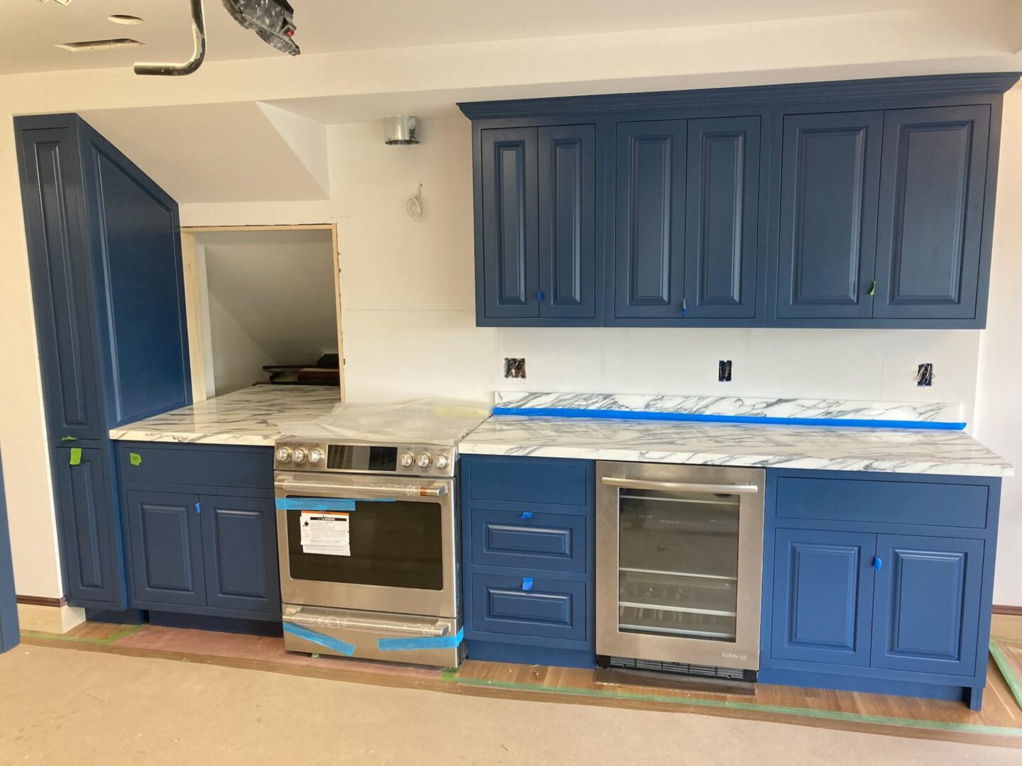 Close view of the blue kitchen cabinets