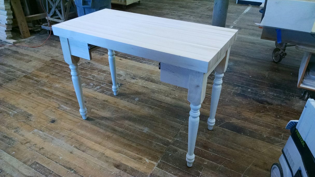 Close view of the white table placed on the floor