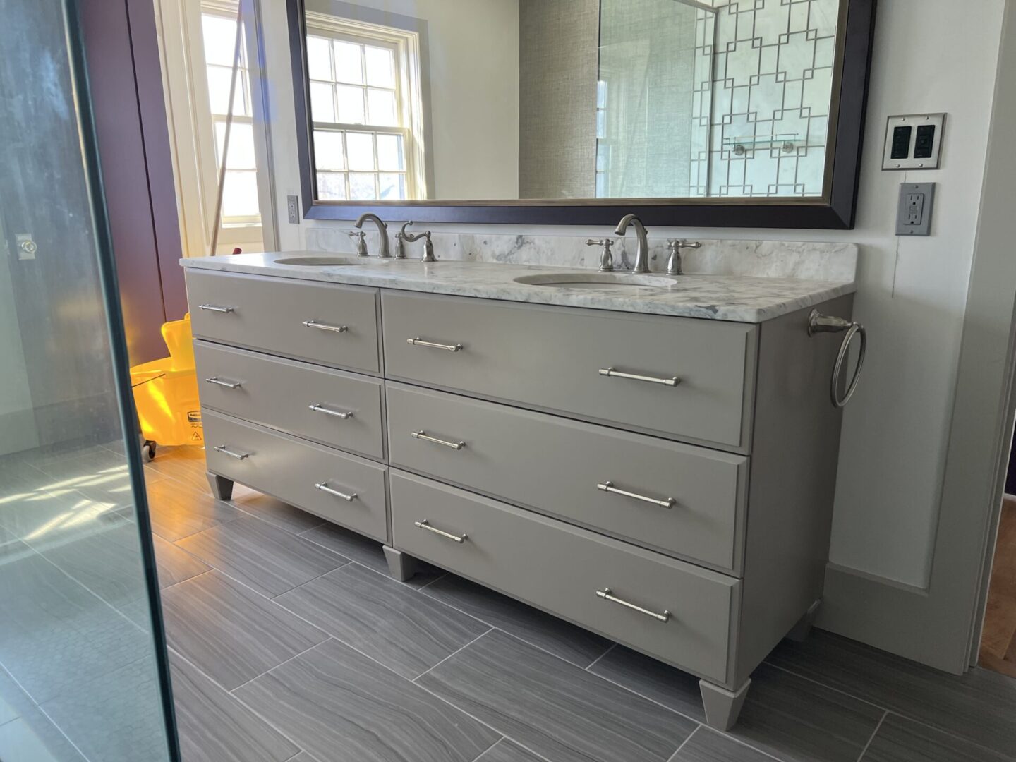 Wash area with mirror and cabinets