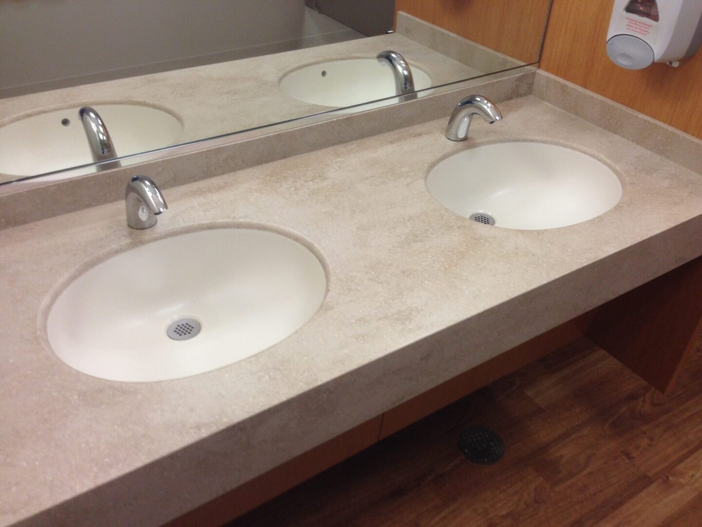 Close view of the two wash basins and mirror