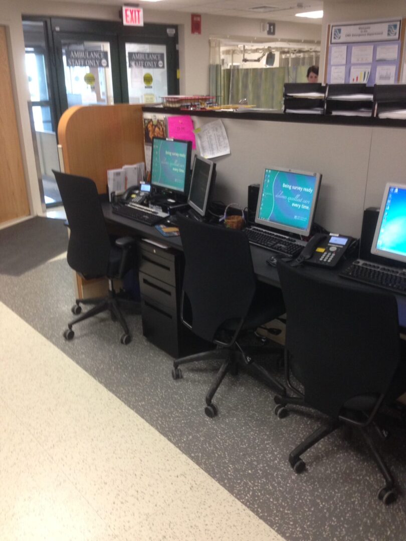 Close view of the computer systems and chairs